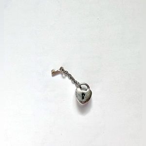 Silver and gold retired Pandora lock charm